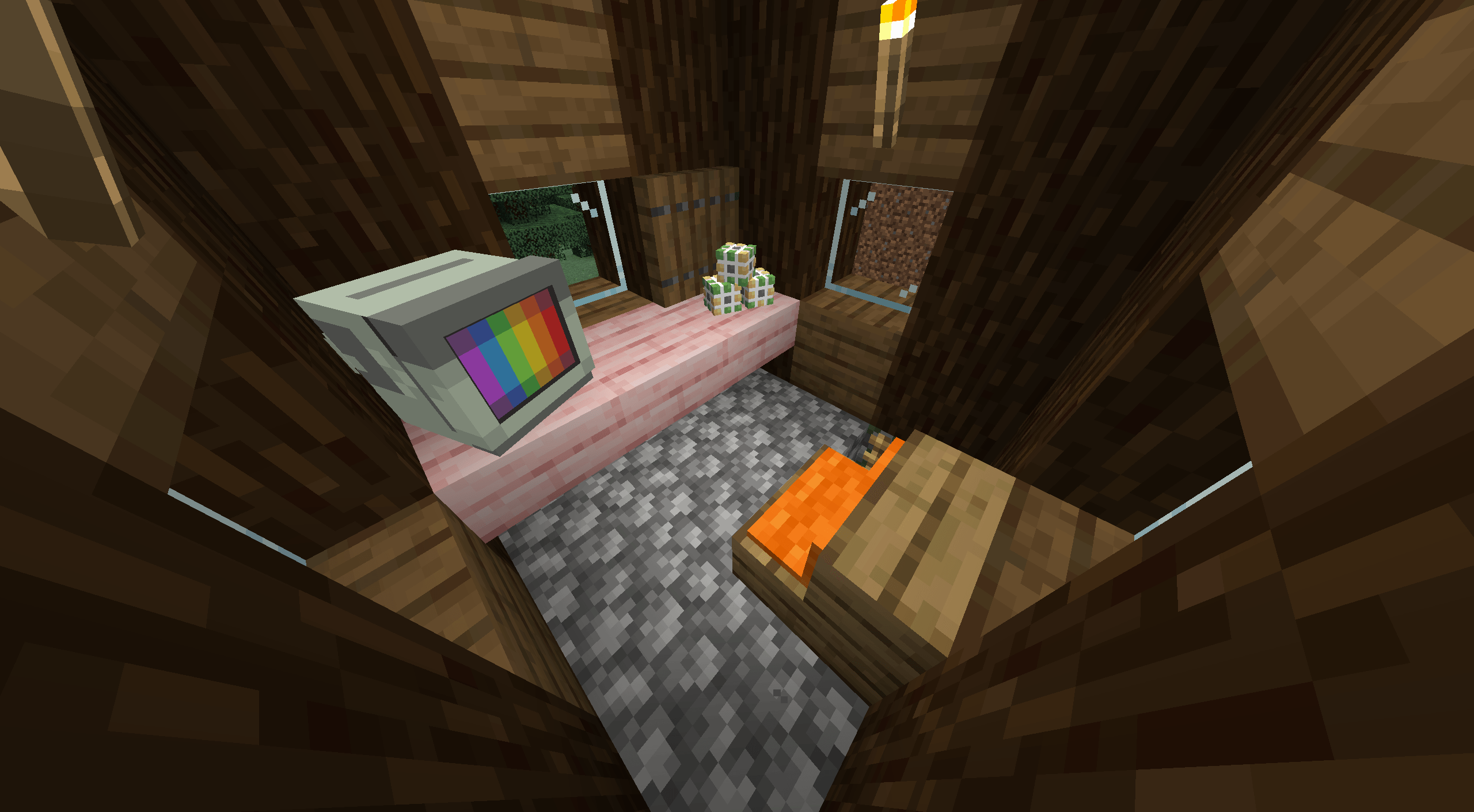 A villager house with a monitor, three rubiks cubes and a pillowed seat