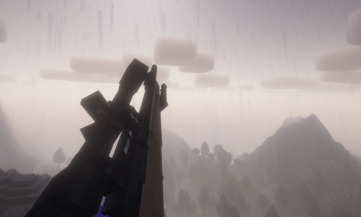 Alt text: First person view of a player holding an XM3 rifle with trees and mountains in the distance, on a muggy, rainy day.