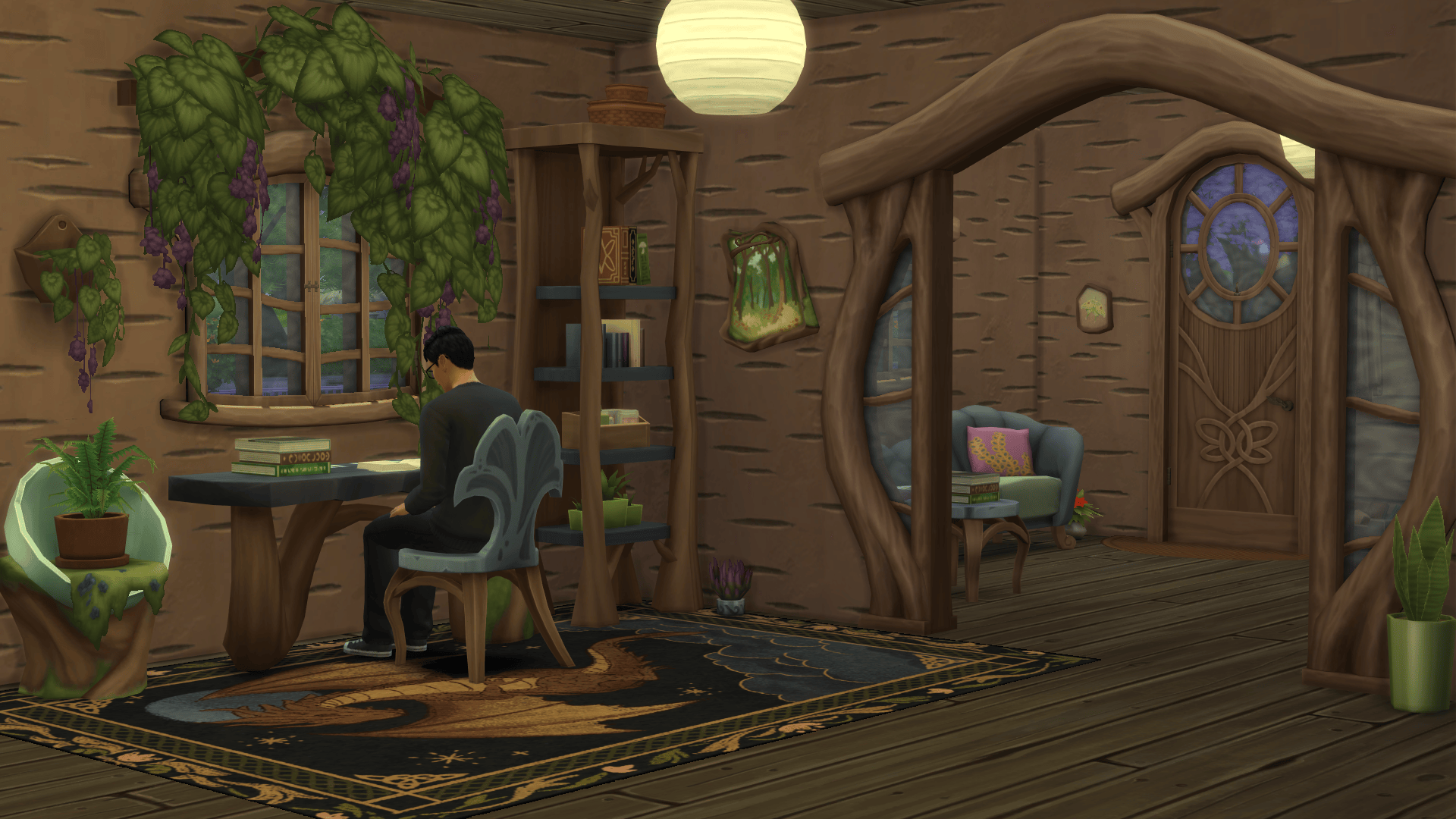 A room making use of a new archway, desk, accent table and separated wall decorations