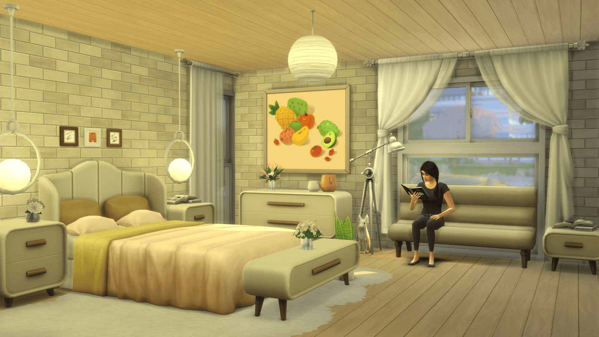 A bedroom that is making use of the new loveseat and a few of the new surfaces, such as the dresser, and two accent tables.