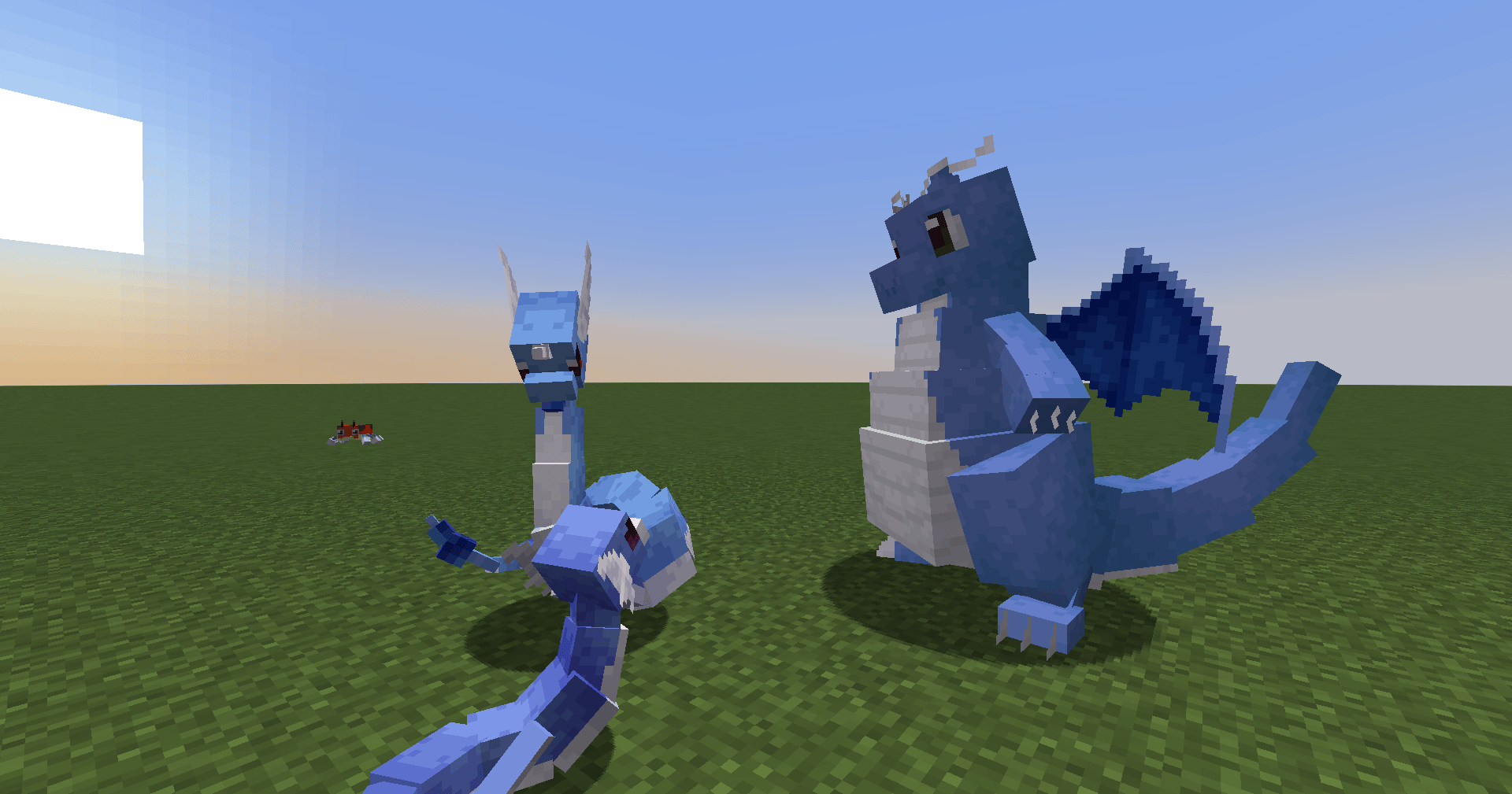 A picture of what Dragonite looks like next to it's previous evolutions