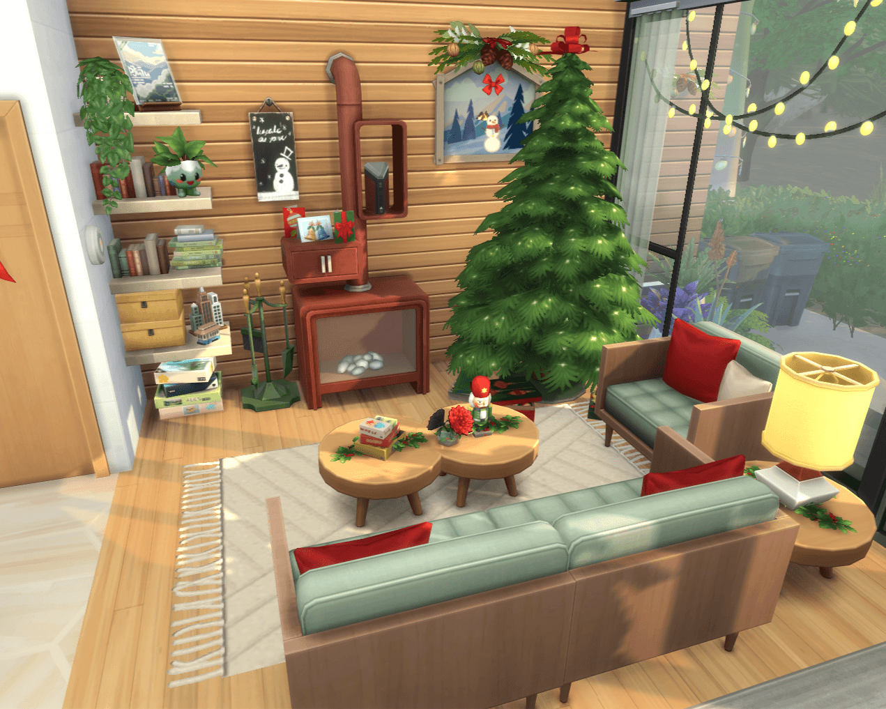 Thumbnail overview of the living room w/fireplace, xmas tree, couch & armchair w/christmas themed pillows and cluttered shelves!