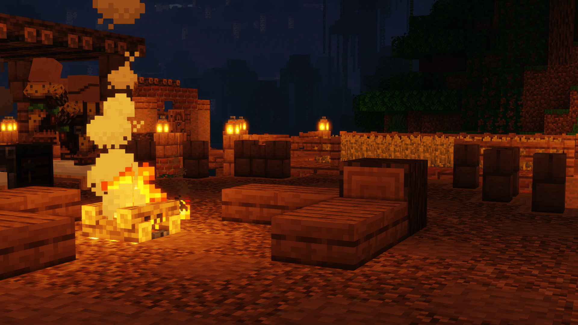 Here is a campfire area with a farm in the background