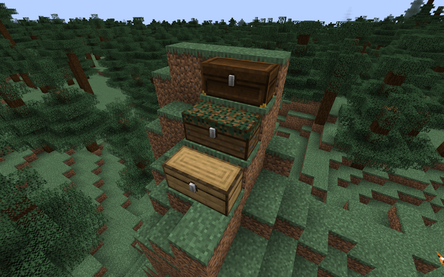 On top of a small hill, a Dark Oak, a Spruce, and an Oak Large Chest.