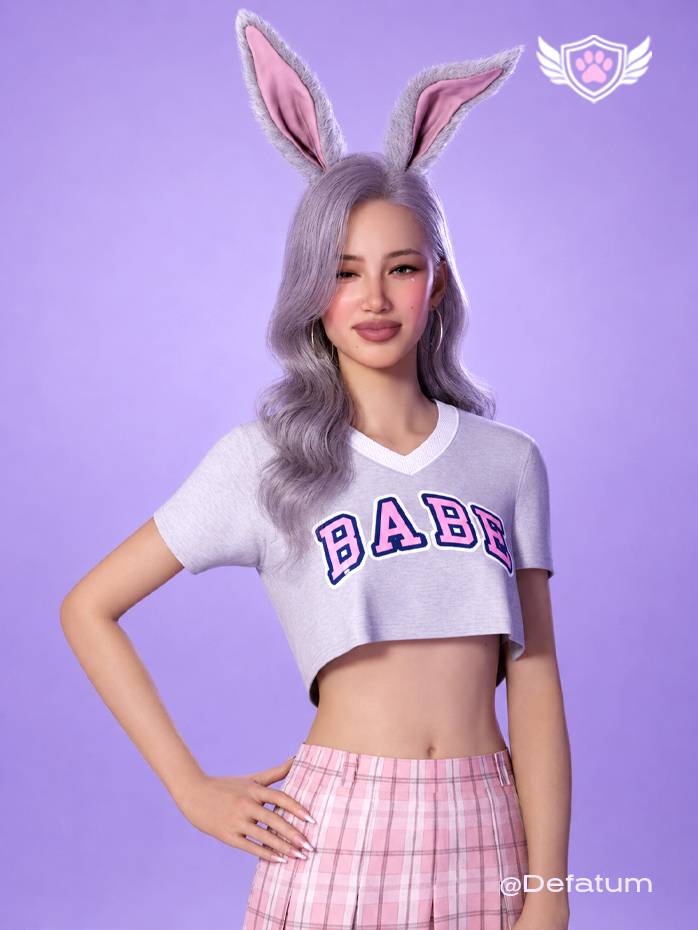 The Campus Sweetheart crop top from the College Core Collection 25’. Heather grey V-neck top with pink “BABE” varsity lettering and white contrast trim.