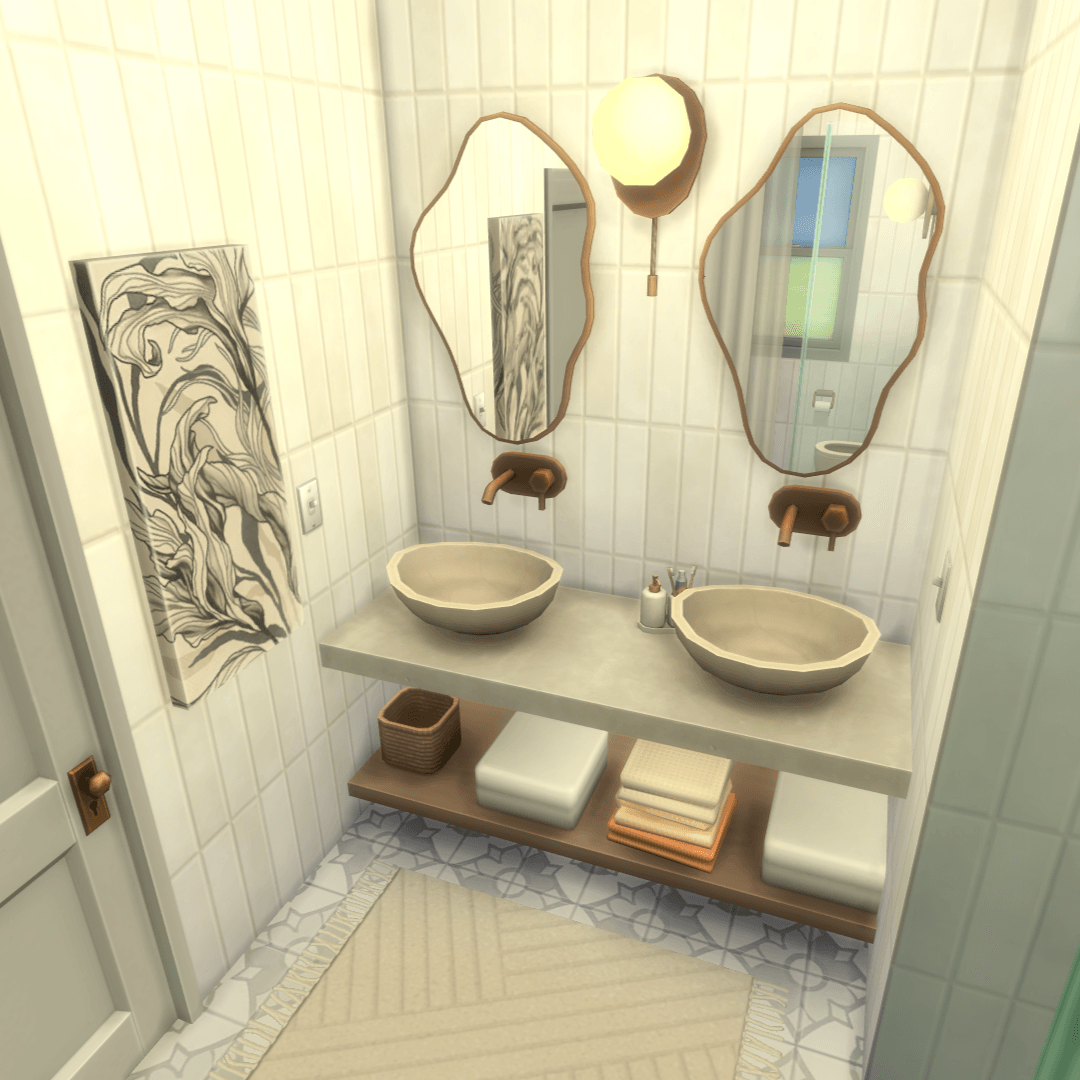 overview of the double sink and mirror vanity area, with counter space, towels, wall sconce & a tray for soap and toothbrushes!