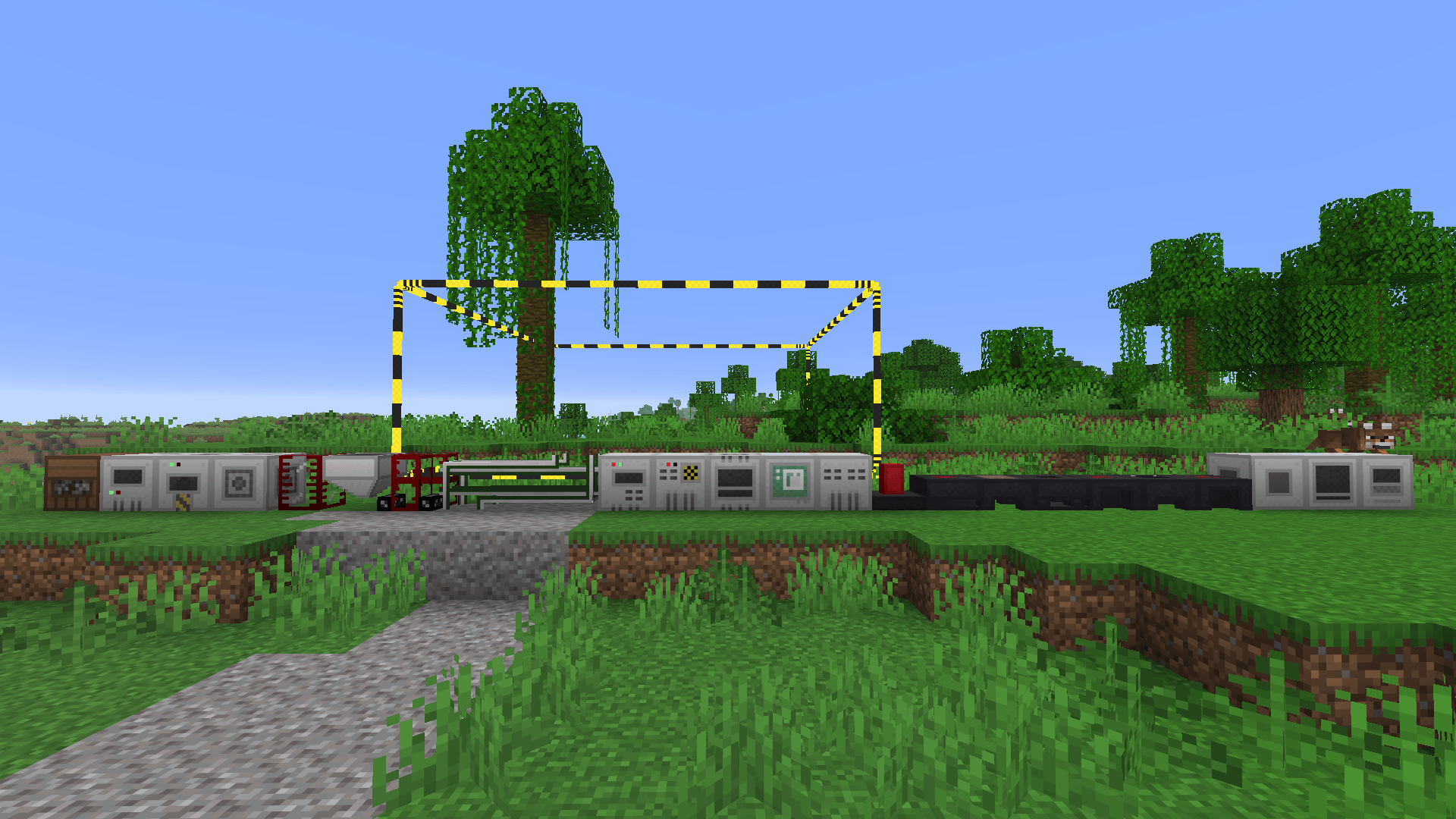 A row of various industrial machines and blocks from the BuildCraft mod placed side-by-side in a Minecraft world