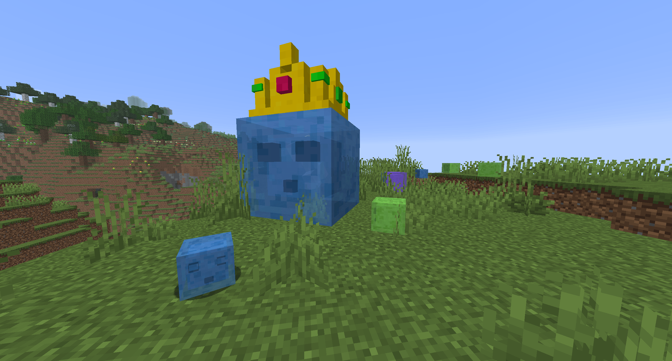 The King Slime (First, weakest boss with ~140 HP) in vanilla Plains biome after spawning with his slime minions.png