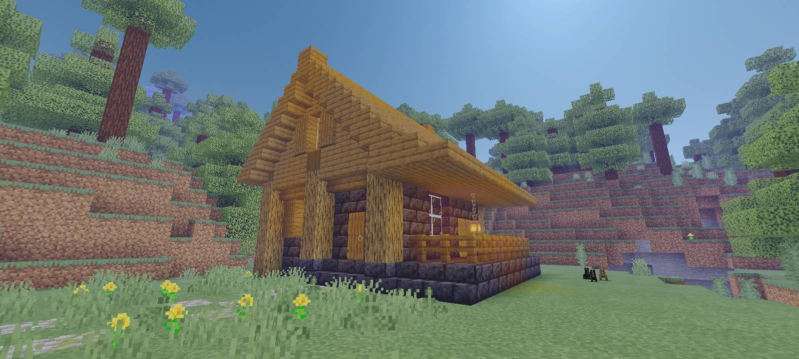 Ember Hollow Starter House, set against terracotta cliffs at golden hour.