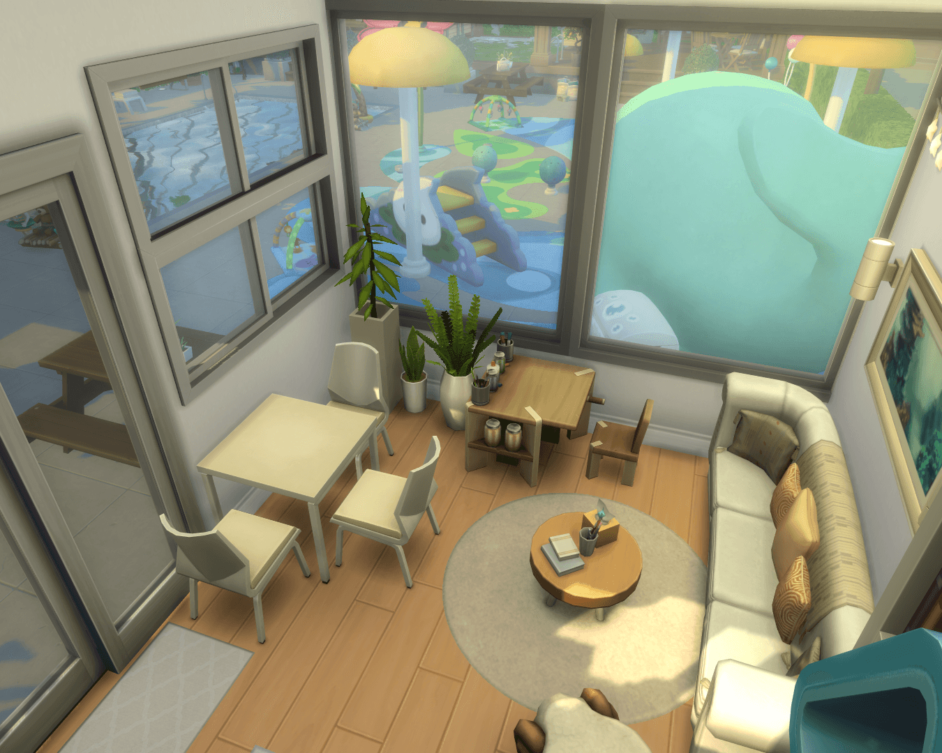 Rest Room, includes a cards table, crafts table, a couch and big glass windows to see out to the pool area & splashpad!