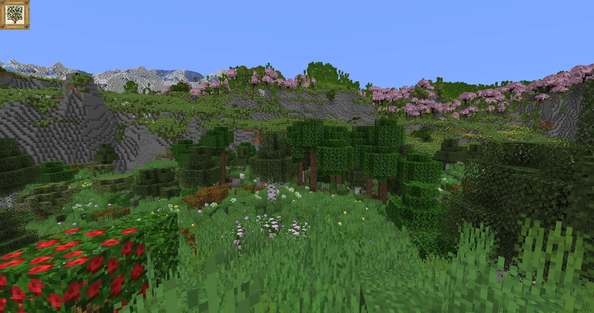 An open Flower Forest flows into some Sunflower Plains before a Cherry Grove on a ridge, with mountain peaks visible in the distance.