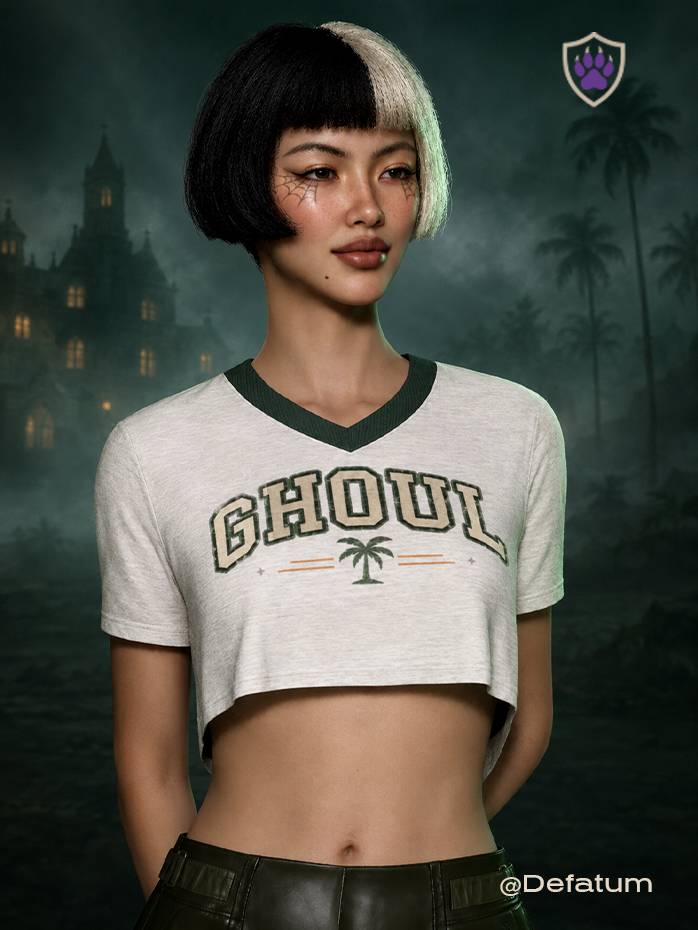 The GHOUL crop top from the Summerween ’26 Special Edition. Vintage ash V-neck top with forest-green trim, distressed collegiate lettering, pumpkin-orange accents, and a retro palm mark.
