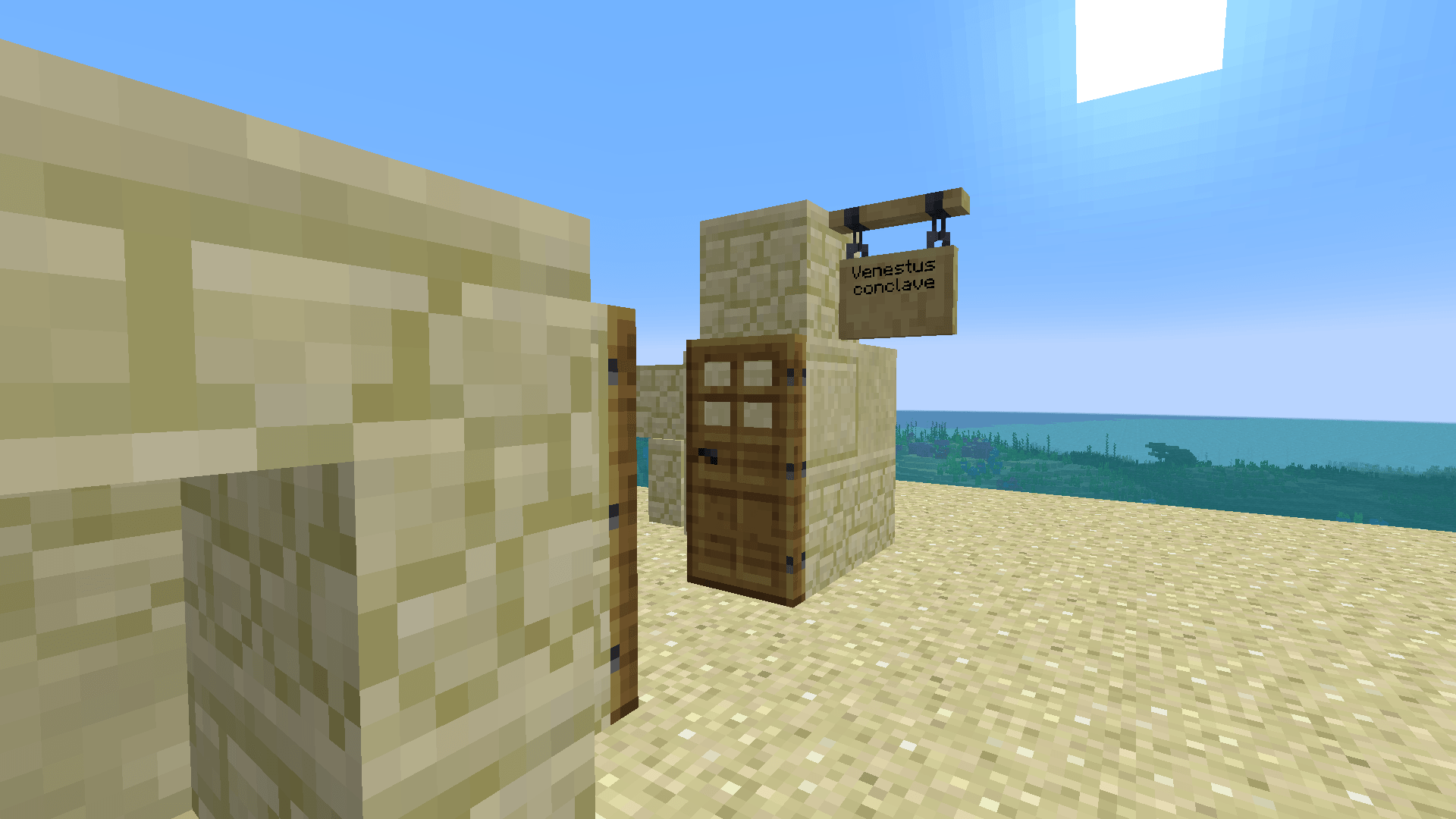 Thumbnail A Desert Ruins just next to a ocean, with a sign in a odd language.
