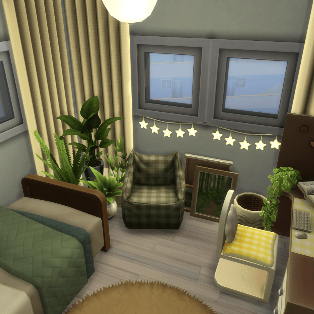 A comfy and cosy nook with an beanbag chair, a plants corner, some painted canvases and string lights!
