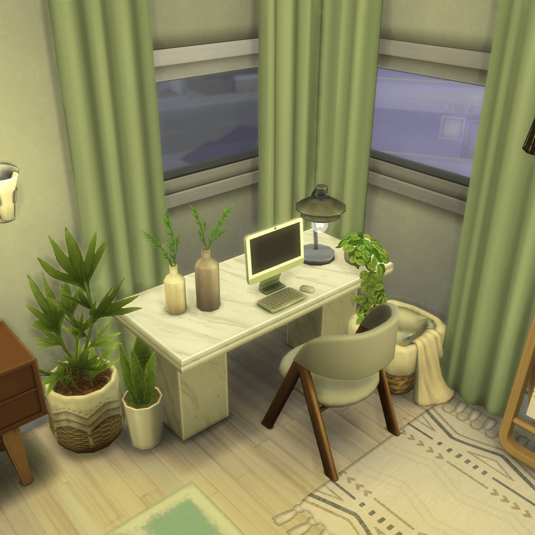 overview of the desk, computer, comfy chair, a cushions & blanket basket to stay cosy, a lamp & lots of plants!