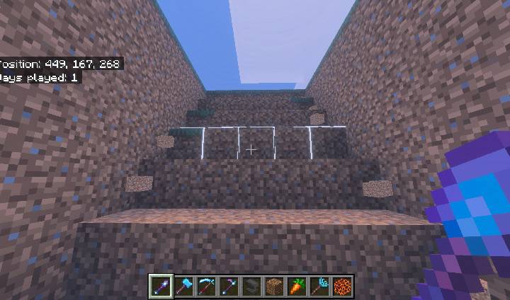 A descending stair-step tunnel cut through dirt by an Excavator, with the white outline on the next step