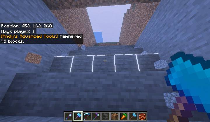 A Hammer's white wireframe outline on the stone face of a stair-step tunnel, with the chat line "Hammered 75 blocks"