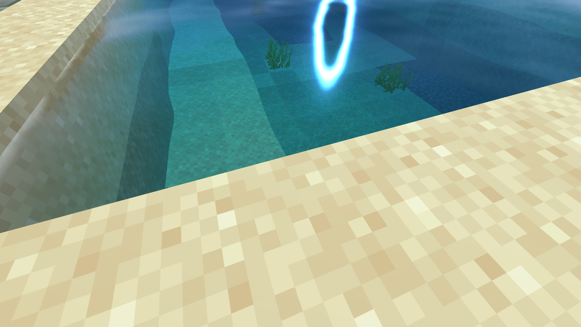 Thumbnail Shallow water blends into the sand with soft, natural colour.