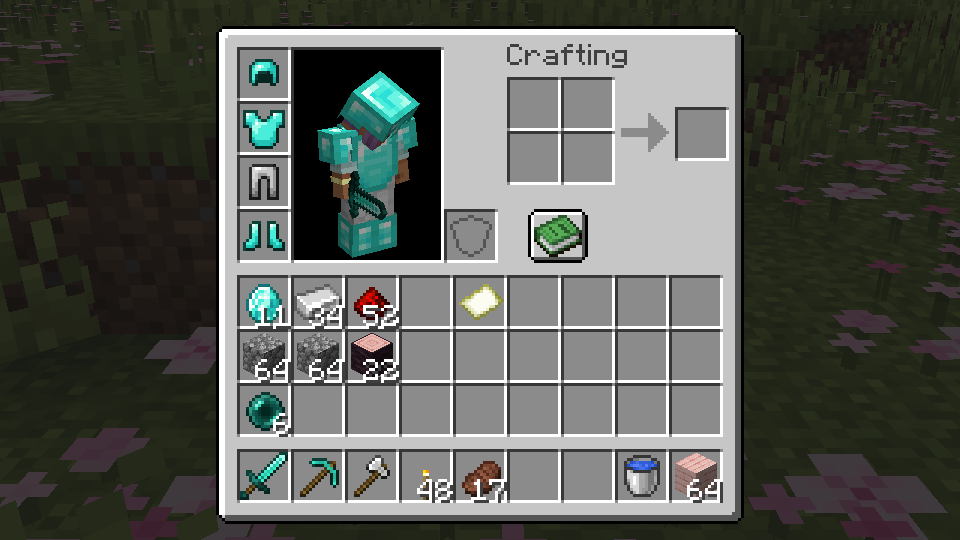 Right click the grave and everything goes back in the same slots, armor included.