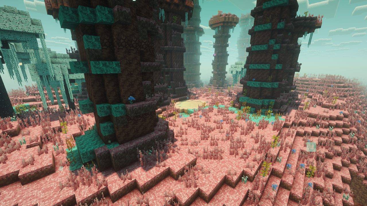 Explore towering red spires and mossy ledges. Java capture with optional Complementary Reimagined shaders.