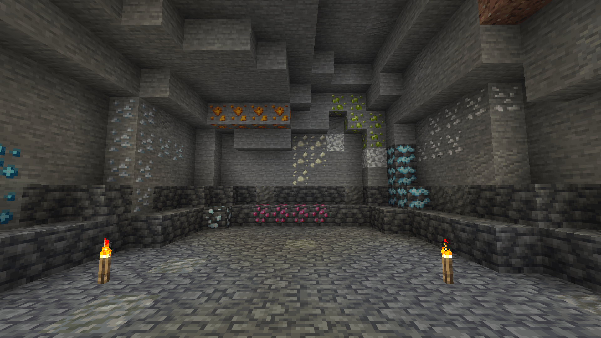 A cave with all ten ores in its walls. Silver, ruby and platinum sit down in the deepslate.