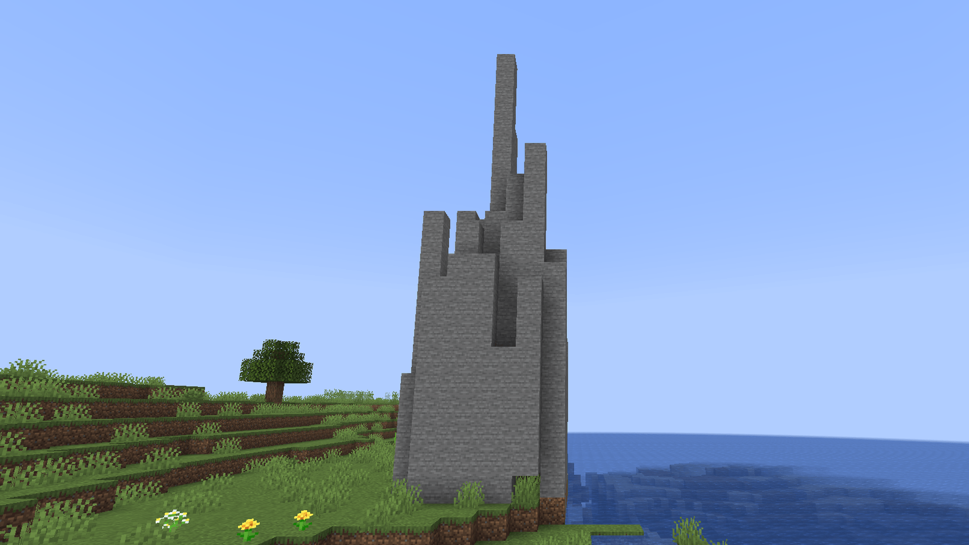 Thumbnail A stone spire on the coast.