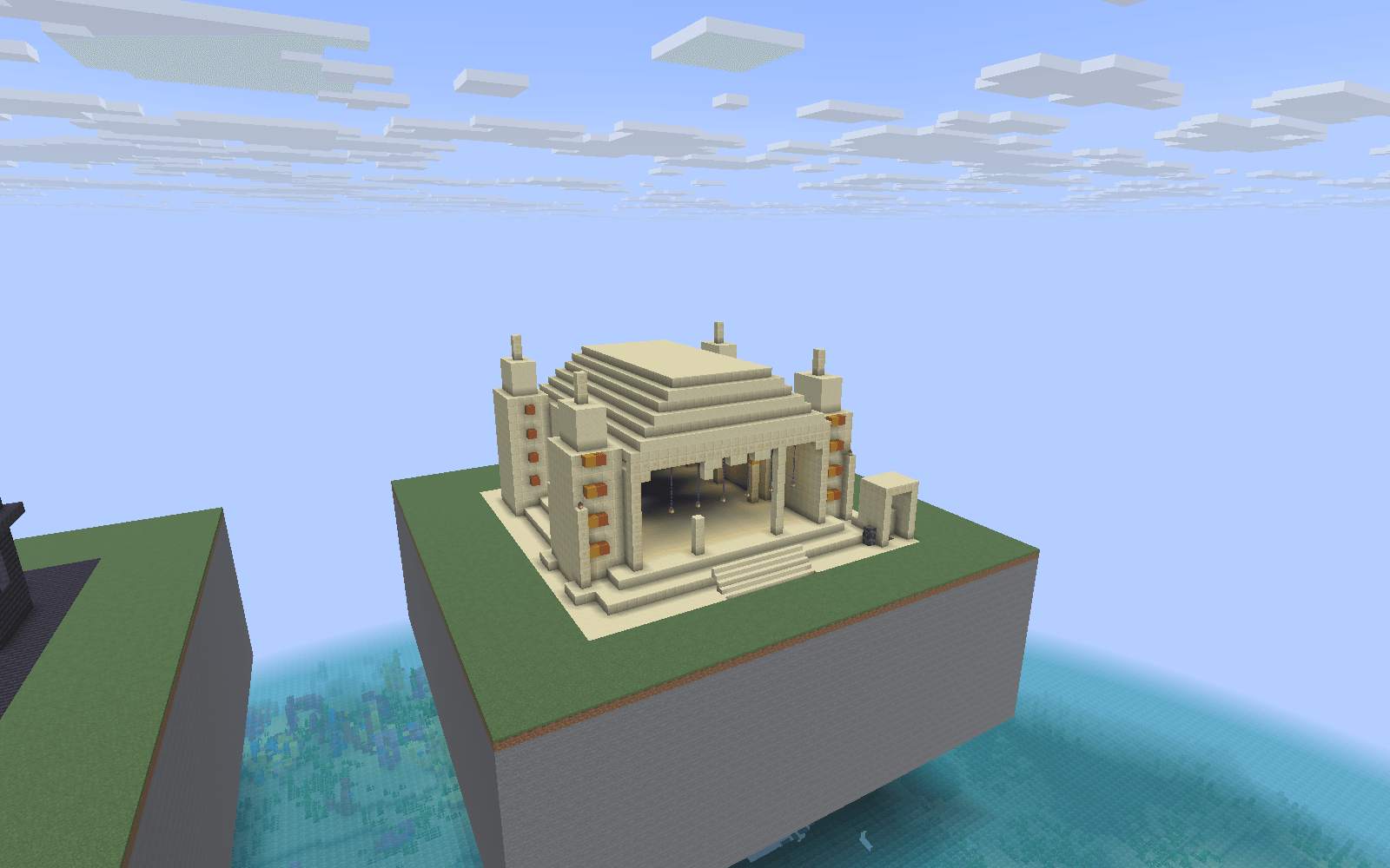 Thumbnail Four engraved pylons, a columned hall, a stepped roof and an altar above the underground arena. The structure is placed on a prepared display site.