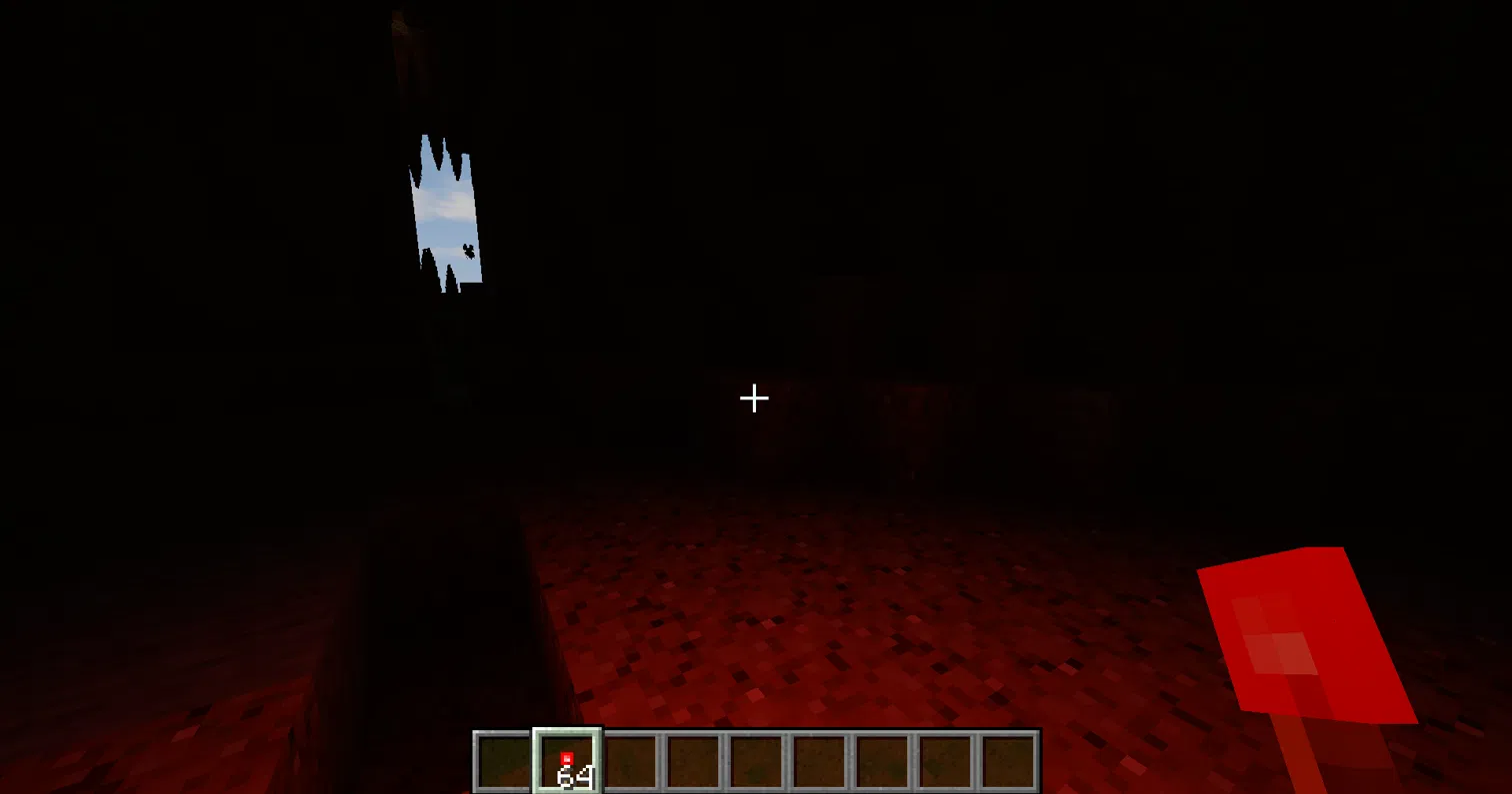 Thumbnail A redstone torch in your hand lights the cave in a soft red glow.