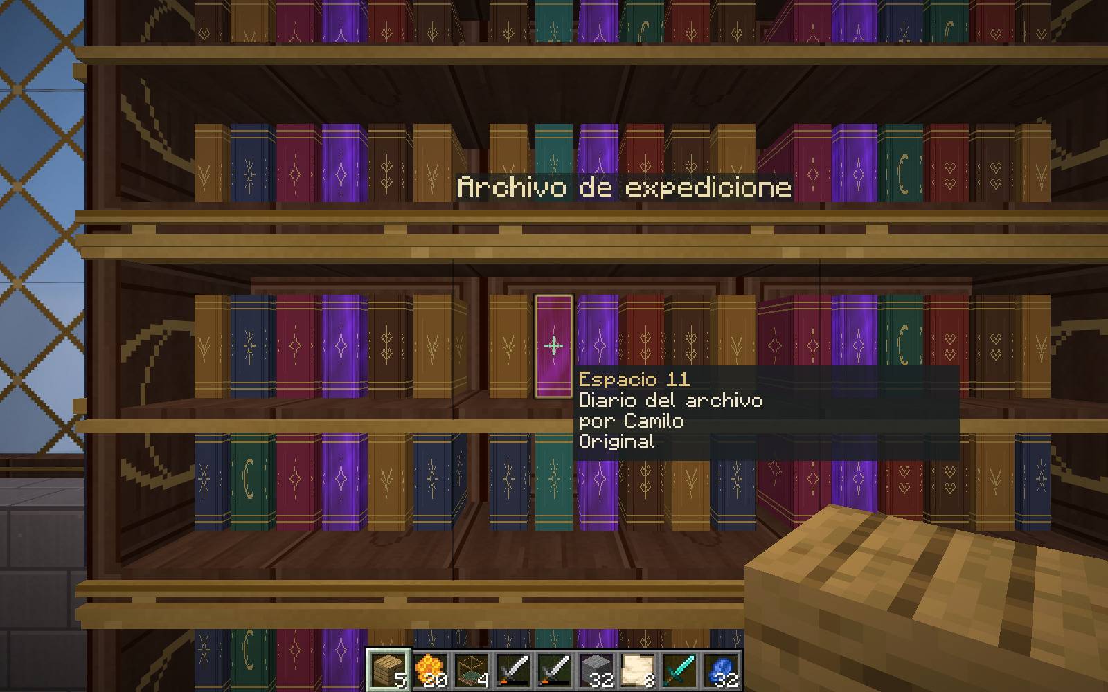 Thumbnail Point at a specific book to see its title or author and retrieve that exact stored item. Actual Minecraft gameplay with Scriptorium display selection.