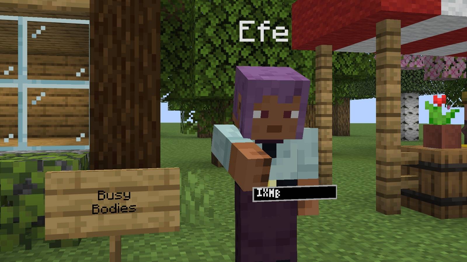 A player writing a sign, with a sign icon over the head