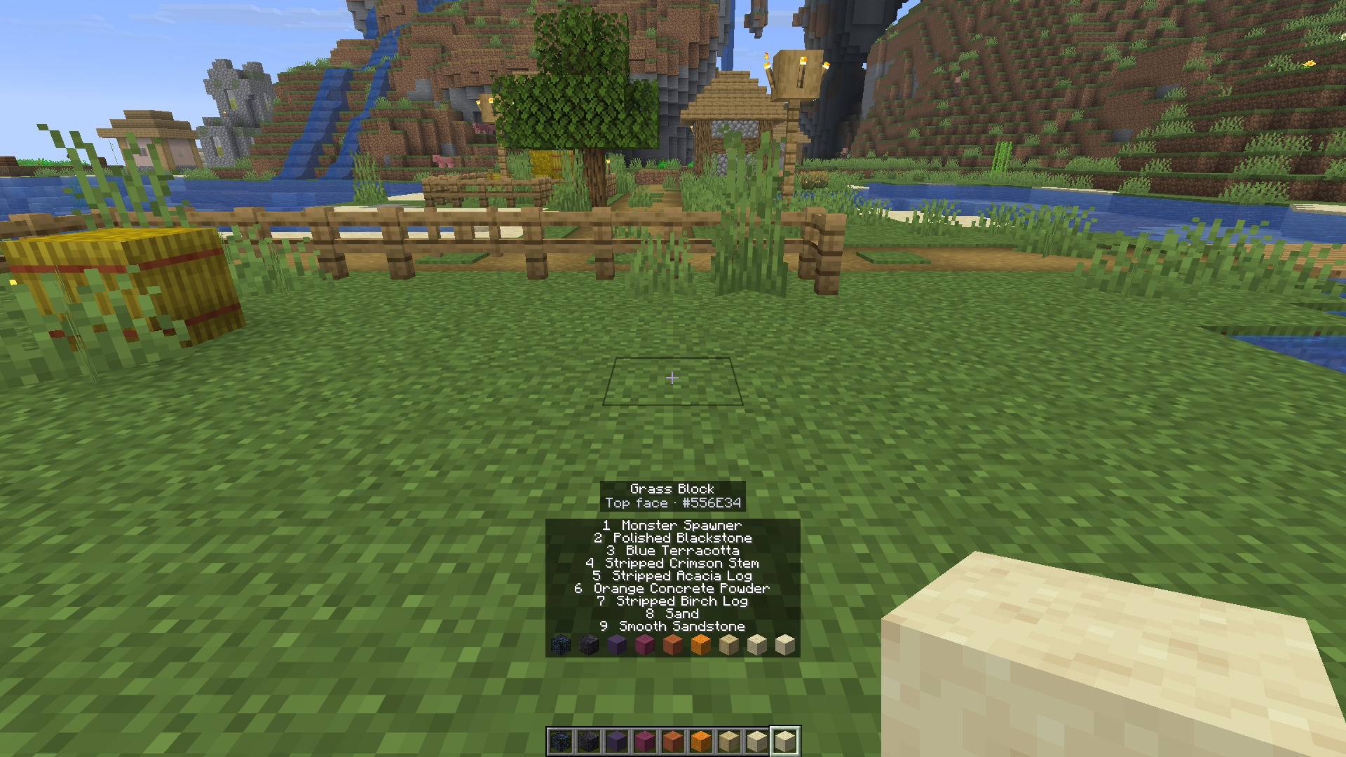 Thumbnail Press X on a block to read its colour, here a grass block's top with the plains tint. Above the hotbar, the names of the nine gradient blocks just put there.
