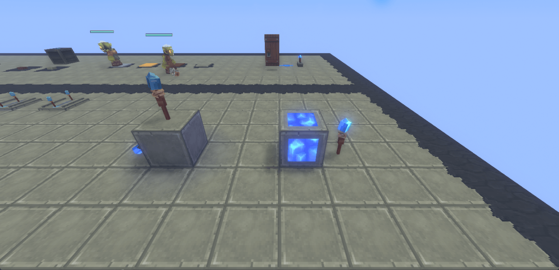 An extinguished torch on a powered support, and a lit torch beside a lamp
