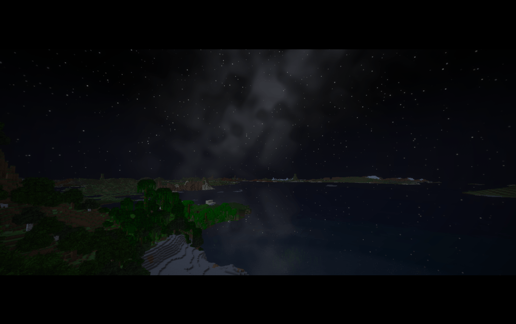A star-filled night sky and its reflection over the coast with oh shiny!