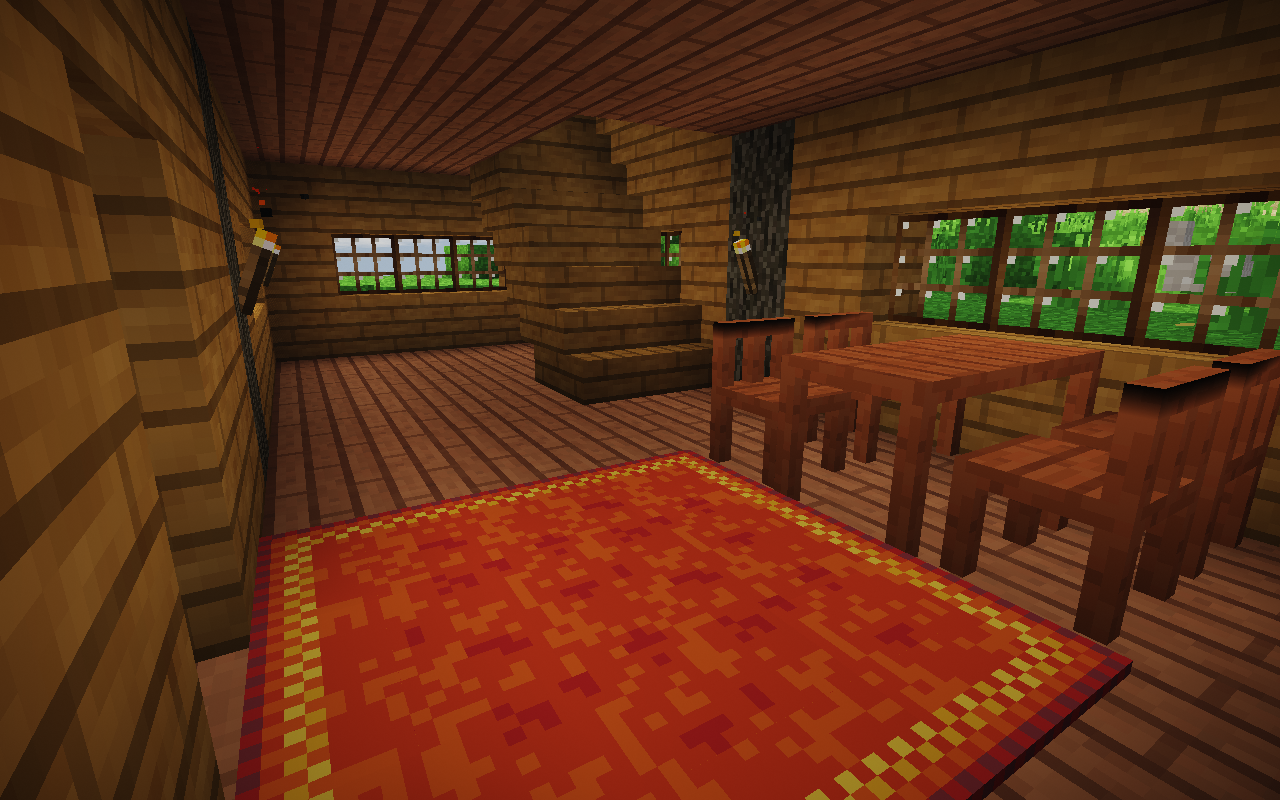 The interior of a house with 4 chairs and a table.