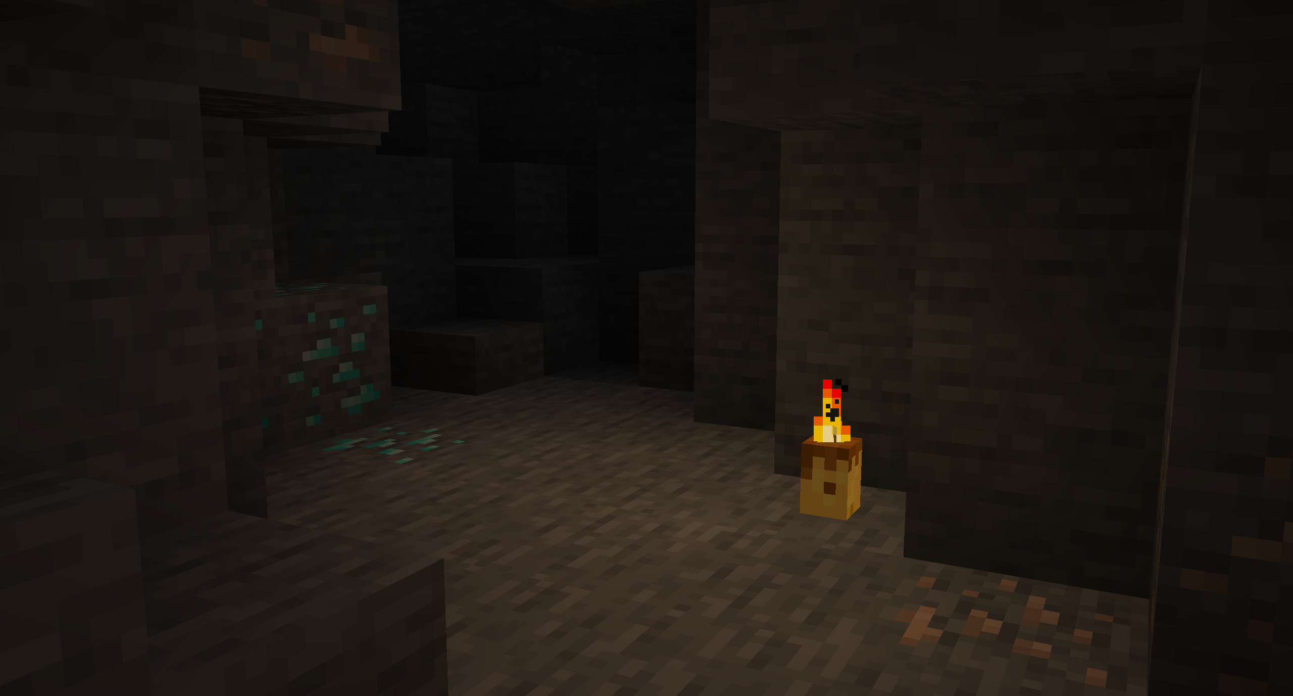 A single candle in a cave (brightness: bright).