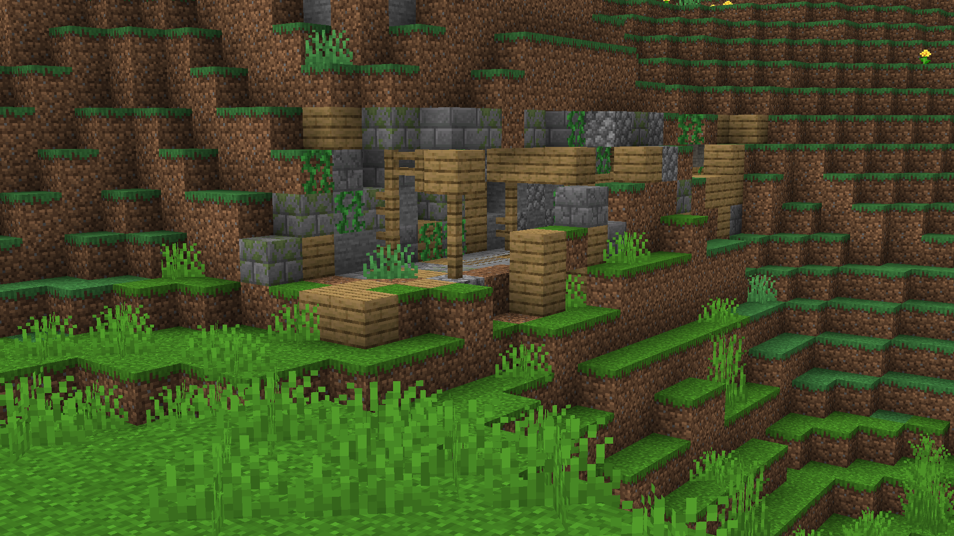 A foreboding entrance to an abandoned mineshaft peeking out of a hillside