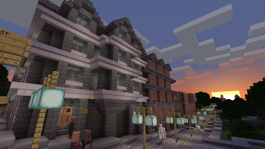 Office building on the left, bookstore with residences upstairs in the middle.