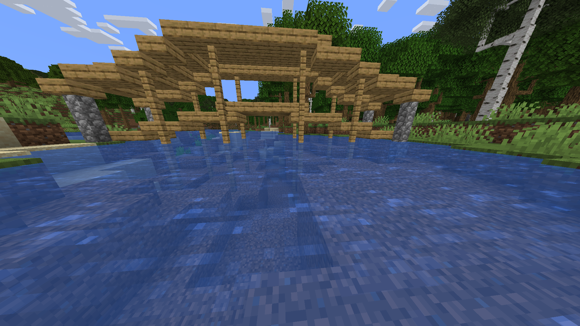 A bridge has been naturally generated near a winding river.