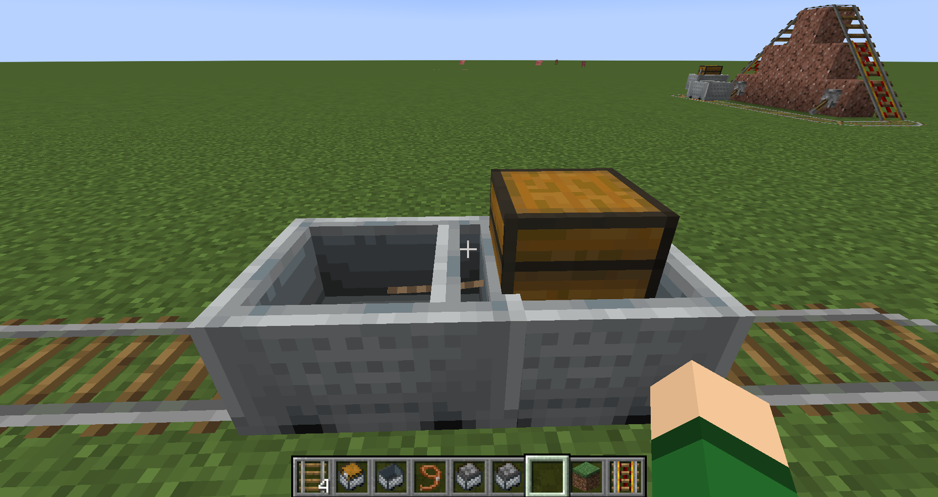 A minecart with chest leashed to another minecart.