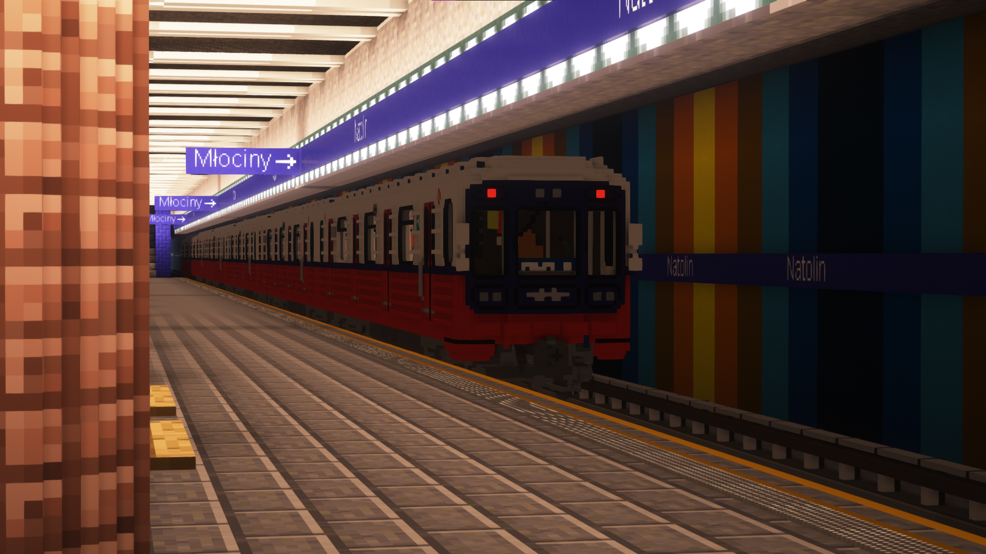 81s in old Warsaw Metro livery departs Natolin station