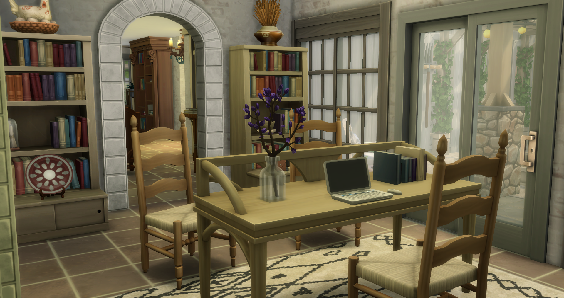 This home office is light in color and leads out to an enclosed garden, fake chicken shed and flower arranging station.