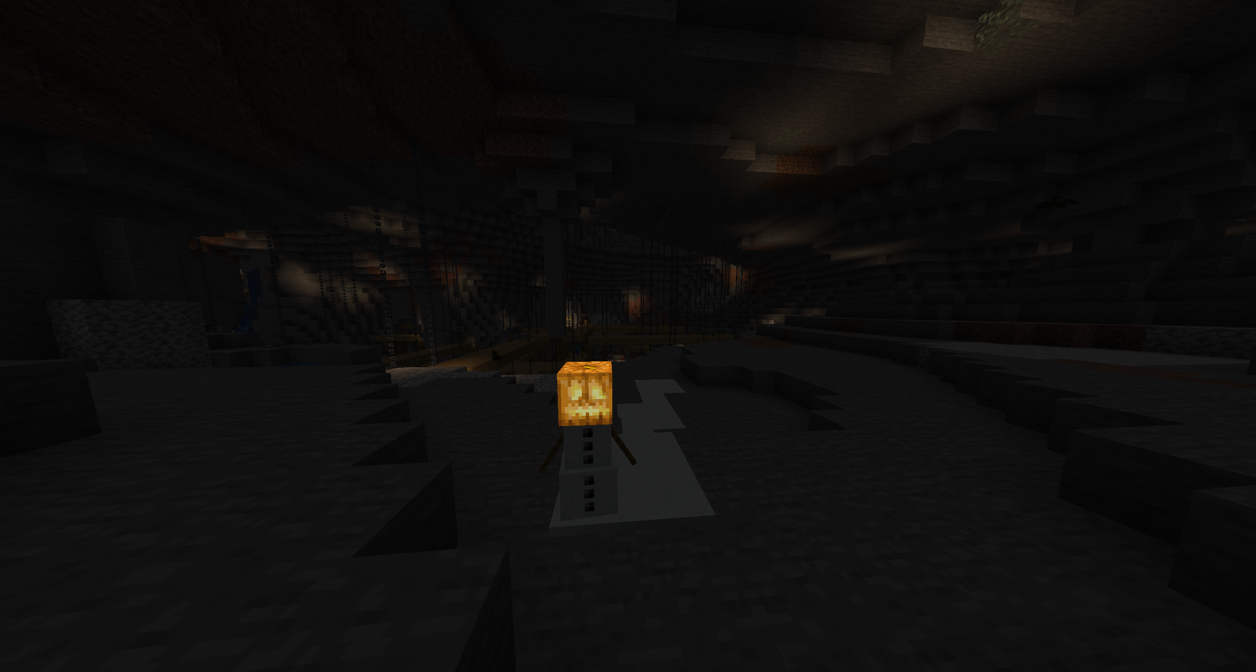 Showing off that the Jack o'Lantern glows in the dark when placed on a snow golem.