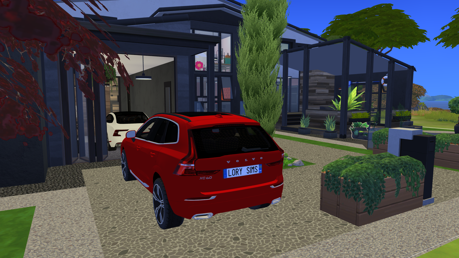 Thumbnail The front driveway is immaculate and well trimmed, with space for a midsize CUV
