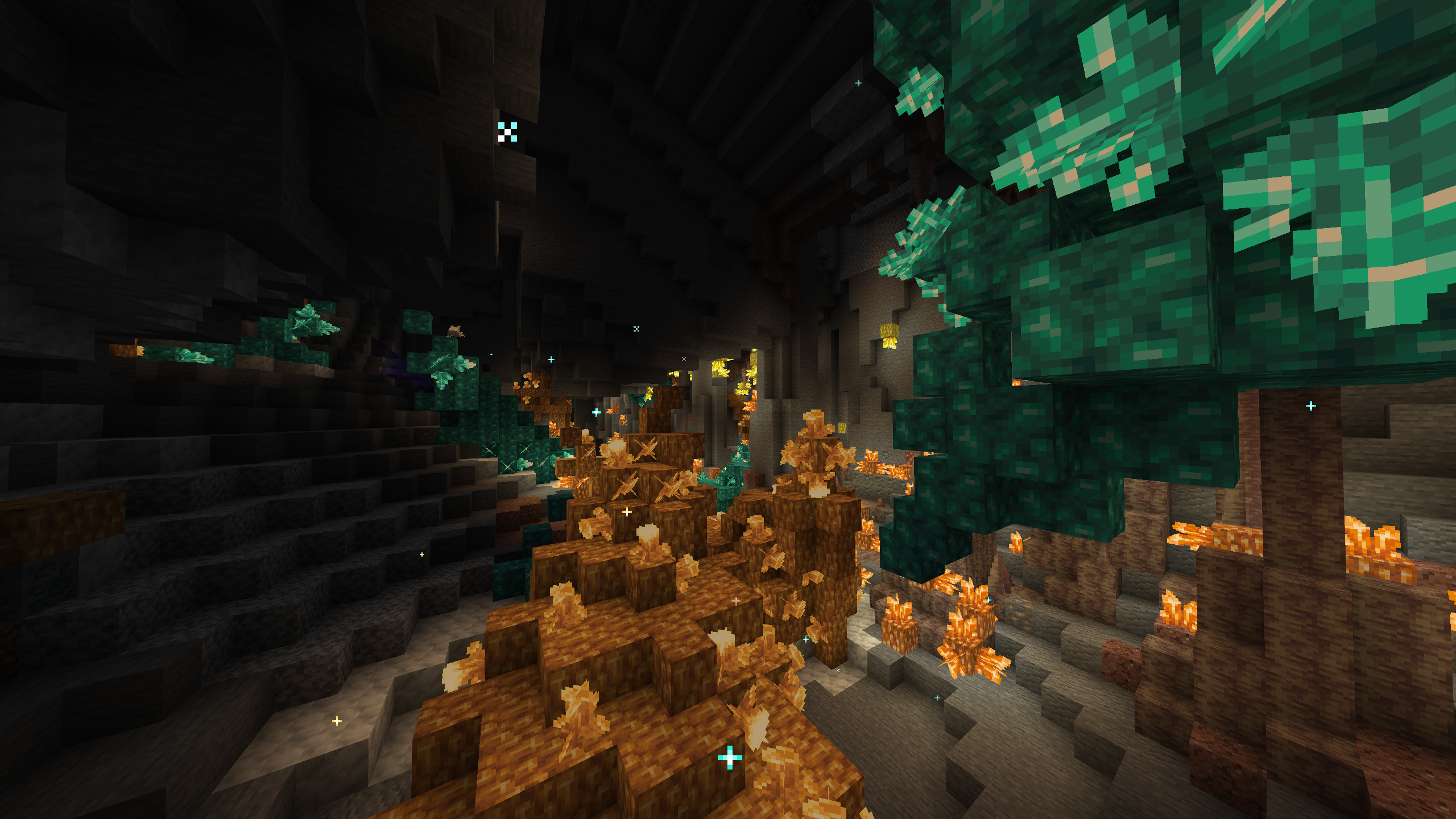 Thumbnail A cave with massive orange and blue crystals growing out of the walls
