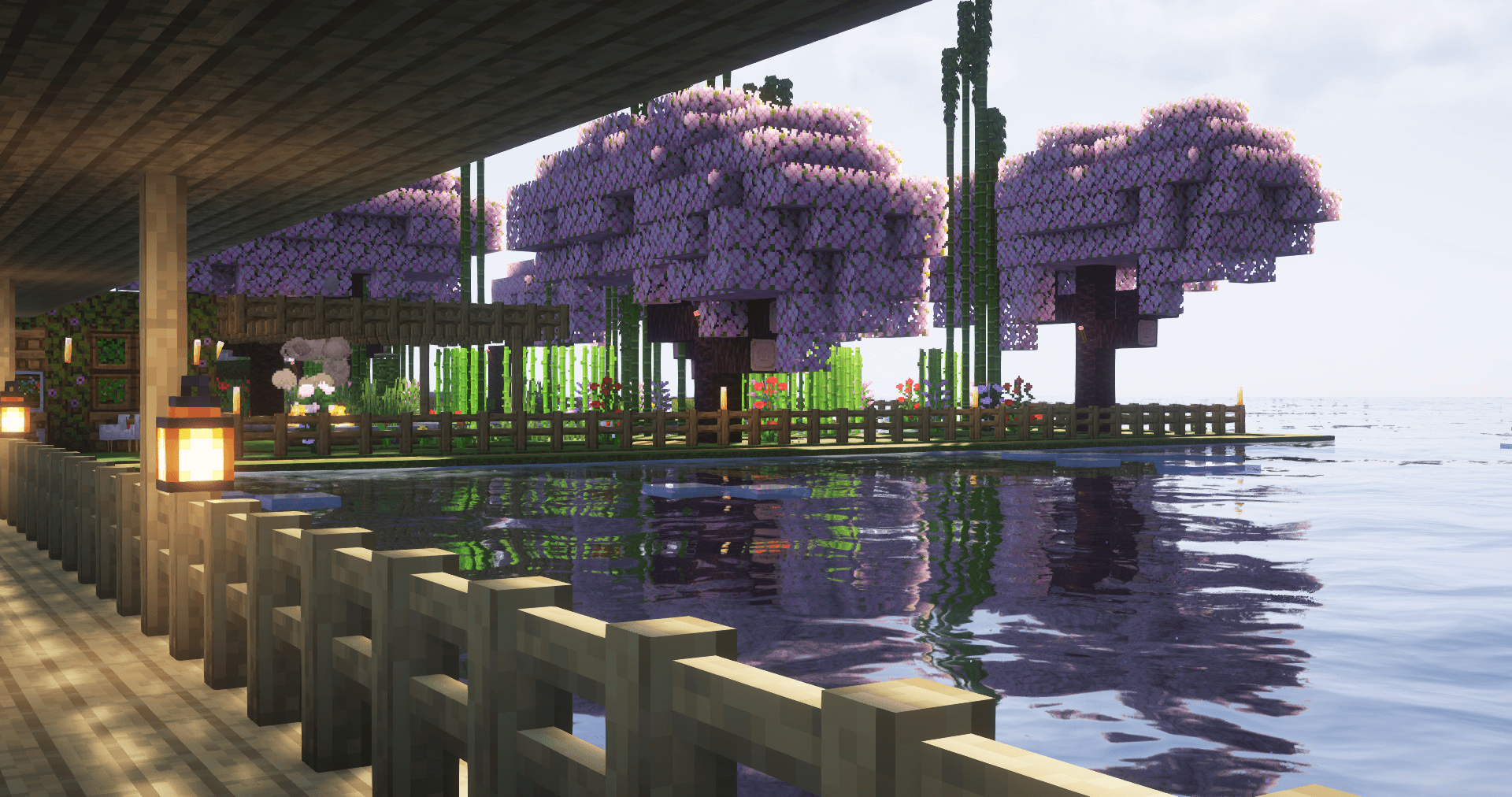 Thumbnail The clear water contrasts the pink cherry blossoms at this seaside garden.