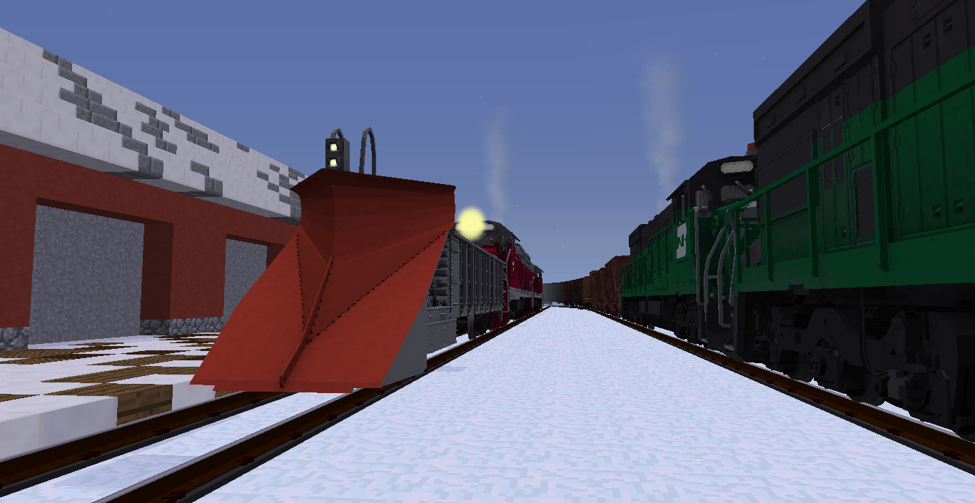 Plow train awaits the mainline to clear as a coal train rumbles by