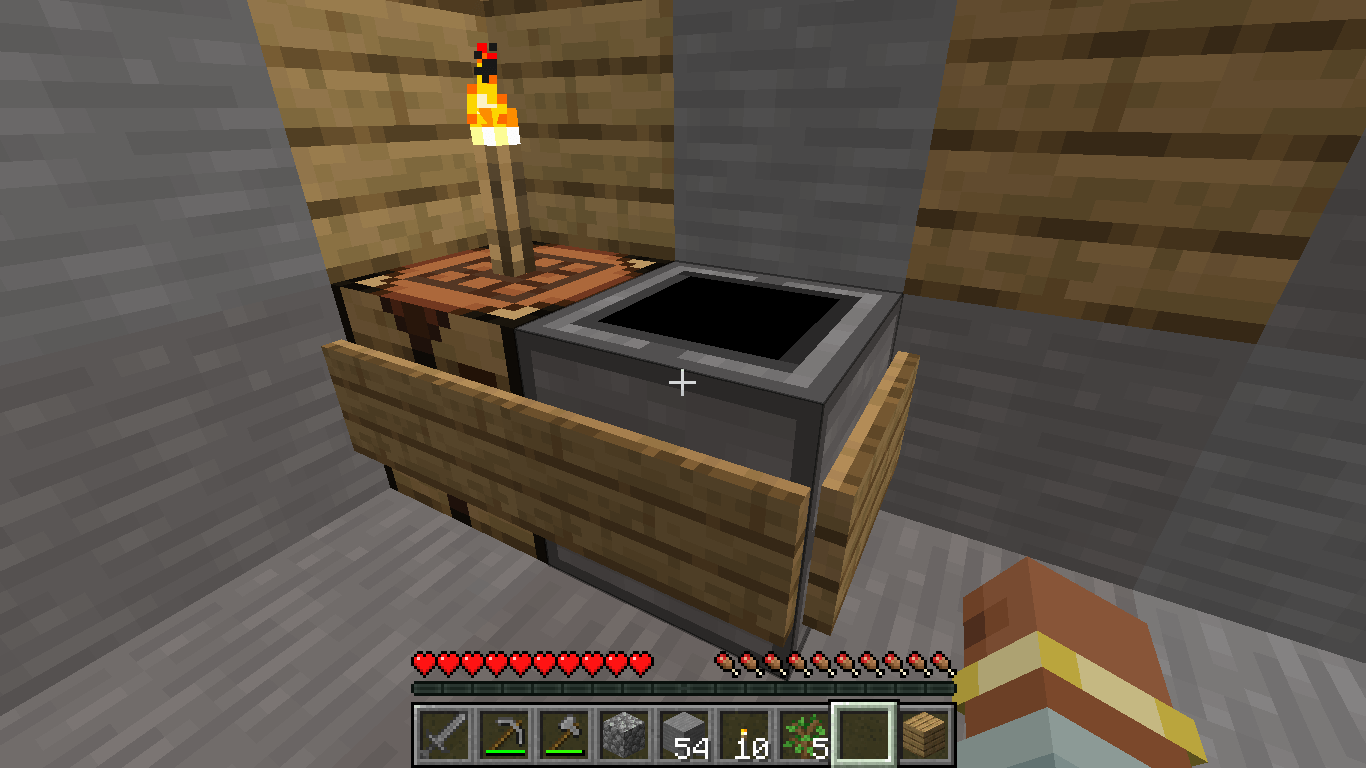 Dirtificator next to a crafting table.