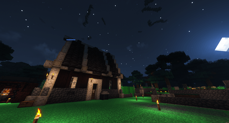 wooden and stone house in the moonlight