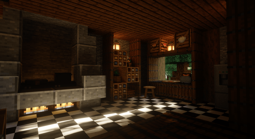 Minecraft kitchen interior showing a large stone fireplace with a glowing fire beneath it. On it is a gray cooking pot and a cooking pan. The floor is a classic black-and-white checkered tile pattern and ceiling is made out of wooden planks.. A wooden counter area features an open window looking out to foliage, along with a small stool, wooden shelving and a toaster