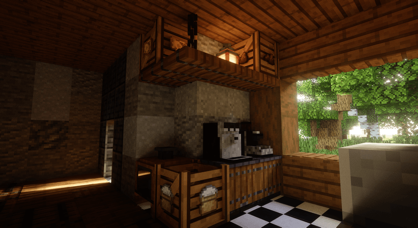 A Minecraft kitchen interior with wooden ceilings, a black-and-white checkered floor, a stone counter with a coffee machine and coffee grinder, a hanging wooden shelf holding a lantern and crates holding coffee and cheese. A large window on the right reveals lush green trees outside.